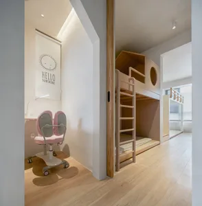 Minimalist children's bedroom with wooden bunk bed.