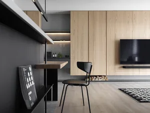 A modern minimalist living room with wood flooring, minimalist furniture, and a TV mounted on a wooden wall panel.