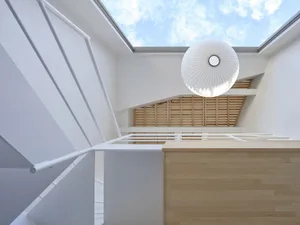 Modern interior design featuring wooden floors and steel beams