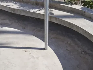 Outdoor architectural ramp constructed from concrete
