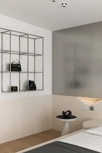 A minimalist bedroom featuring metal-frame shelves, wooden floor, and marble tabletop.