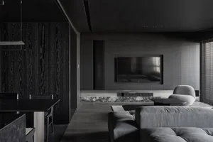 Contemporary living room with black stained wood, marble accents, and leather seating.
