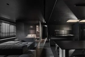 A modern living room featuring dark wood furniture and flooring.
