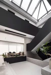 Modern living room with concrete and black accents