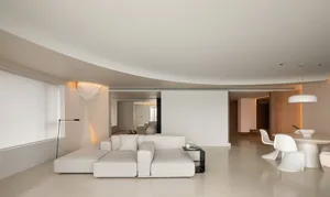 A modern minimalist living room with neutral colors.