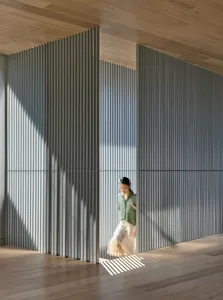 A modern, room divider made of metal panels