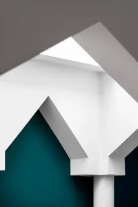 Architectural design featuring white geometric shapes against a blue background.