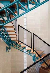 Metal staircase with a modern design, featuring industrial materials and an open layout.