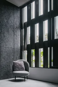 A modern interior design featuring a glass window with light filtering through.
