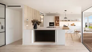 Modern minimalist kitchen with white cabinets, wooden island, and glass elements.
