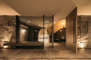 A modern interior space featuring concrete and wood materials.