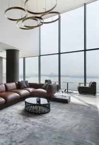 A modern living room with floor-to-ceiling windows overlooking a cityscape.