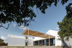 A modern residential building with white exterior.
