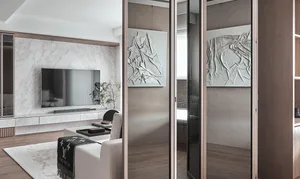 Modern living room with marble wall and concrete elements.