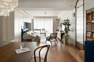 Contemporary living room featuring wooden furniture and fabric accents.