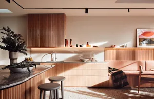 A modern minimalist kitchen with wooden cabinets, marble countertops, and minimalist decor.