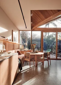 Modern kitchen and dining room featuring a terrazzo-tiled floor