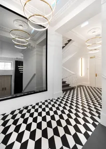 A modern space featuring a black and white checkered tile floor.
