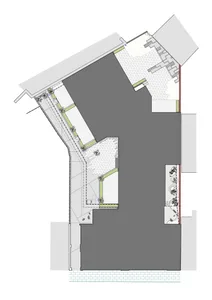 A detailed architectural plan showing a modern building with concrete and tiled flooring.