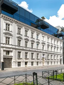 Modern, city office building with white stone and brick exterior.