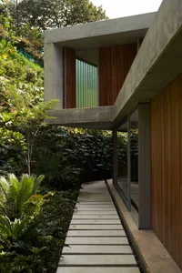 A modern house with concrete and glass materials.