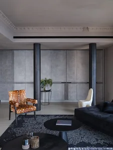 Modern living room with metal, wood, leather, and concrete materials