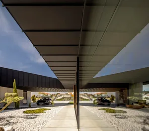 Modern residential exterior with concrete facade and minimalist design.