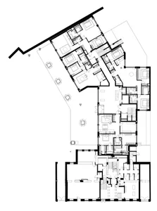 A modern industrial architectural floor plan of a residential building with minimalist design and exposed concrete finishes.
