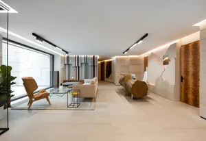 Modern industrial lobby featuring concrete and wooden elements