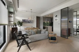 A modern minimalist living room with concrete and wood elements.