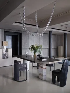 Modern restaurant interior with concrete floors and walls, minimalistic design, and contemporary art installations.