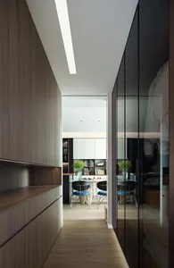A modern office space featuring minimalist design with wooden elements, glass doors, and metallic accents.