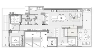 Floor plan illustration of a modern residential building with multiple rooms and living spaces.