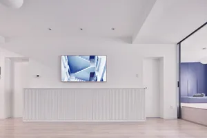 Minimalist white staircase in an interior design setting.