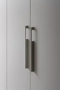 Modern minimalist kitchen or bathroom cabinetry with metal handles