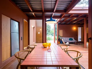 Industrial-style dining area with a tile table and wooden chairs.