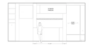 A floor plan with plywood paneling, a solid door, and a person standing in the middle.