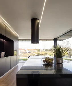 Contemporary kitchen interior with black and white design elements.