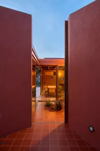 A modern interior space featuring a concrete floor and walls.