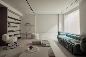 A minimalist living room with concrete flooring, a plush upholstered sofa, and a concrete coffee table.