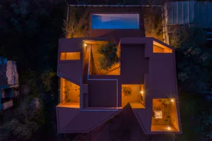 Aerial view of a modern residential architecture featuring a pool, tree, and open spaces with ceramic tile flooring and stair
