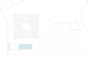 Floor plan of a residential building featuring concrete and glass materials.