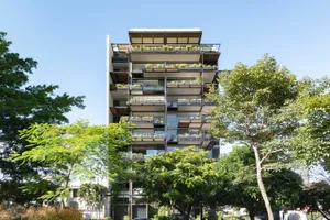 Modern residential building featuring glass and stone materials.