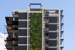 Modern apartment building with a vertical garden wall