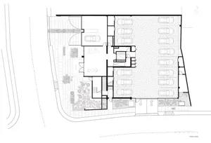 Floor plan of a metallic building with multiple levels and a parking garage.
