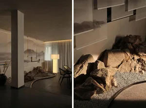 A modern living room featuring a stone and gravel floor, glass elements, and metal accents.