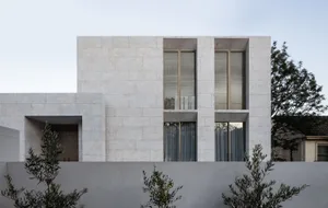 Modern house exterior with white marble finish.