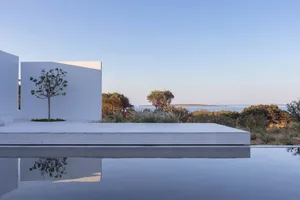 Modern residential exterior featuring sleek lines and large glass panels