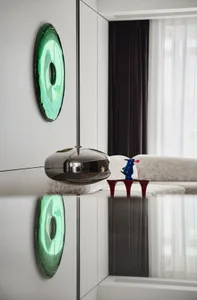 A modern living room featuring white metal ornaments and white furniture.
