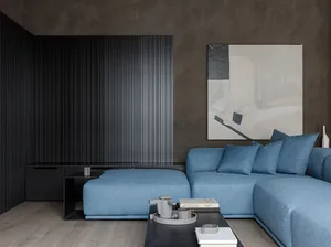 Modern living room featuring a blue fabric sofa and abstract wall art.